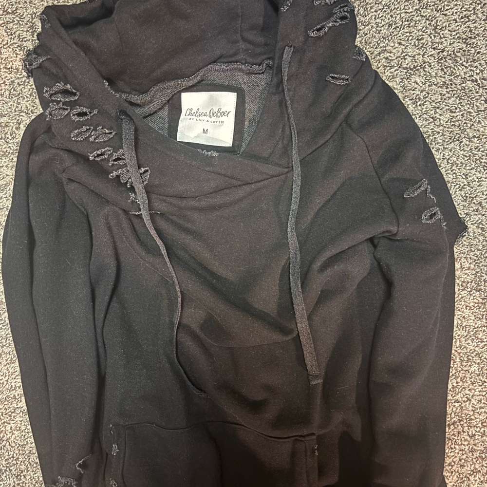 Black distressed hoodie by Chelsea DeBoer